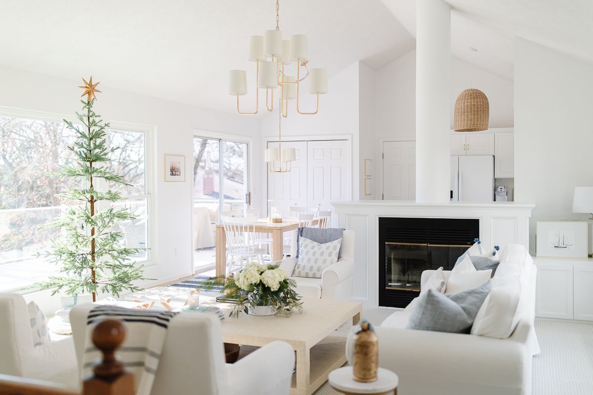 A home painted in Chantilly Lace from Benjamin Moore, Christmas tree in the living room
